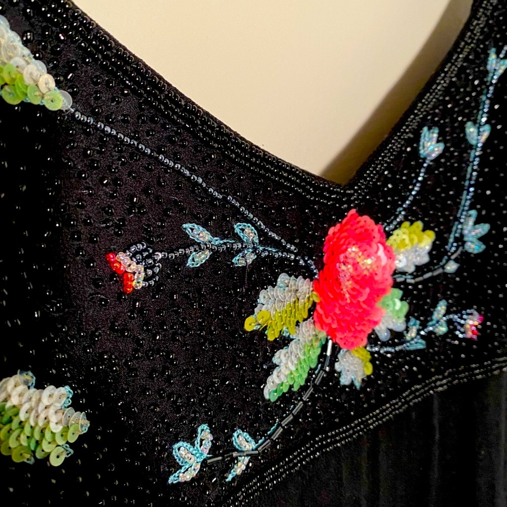 Cache dress with beautiful sequence details.